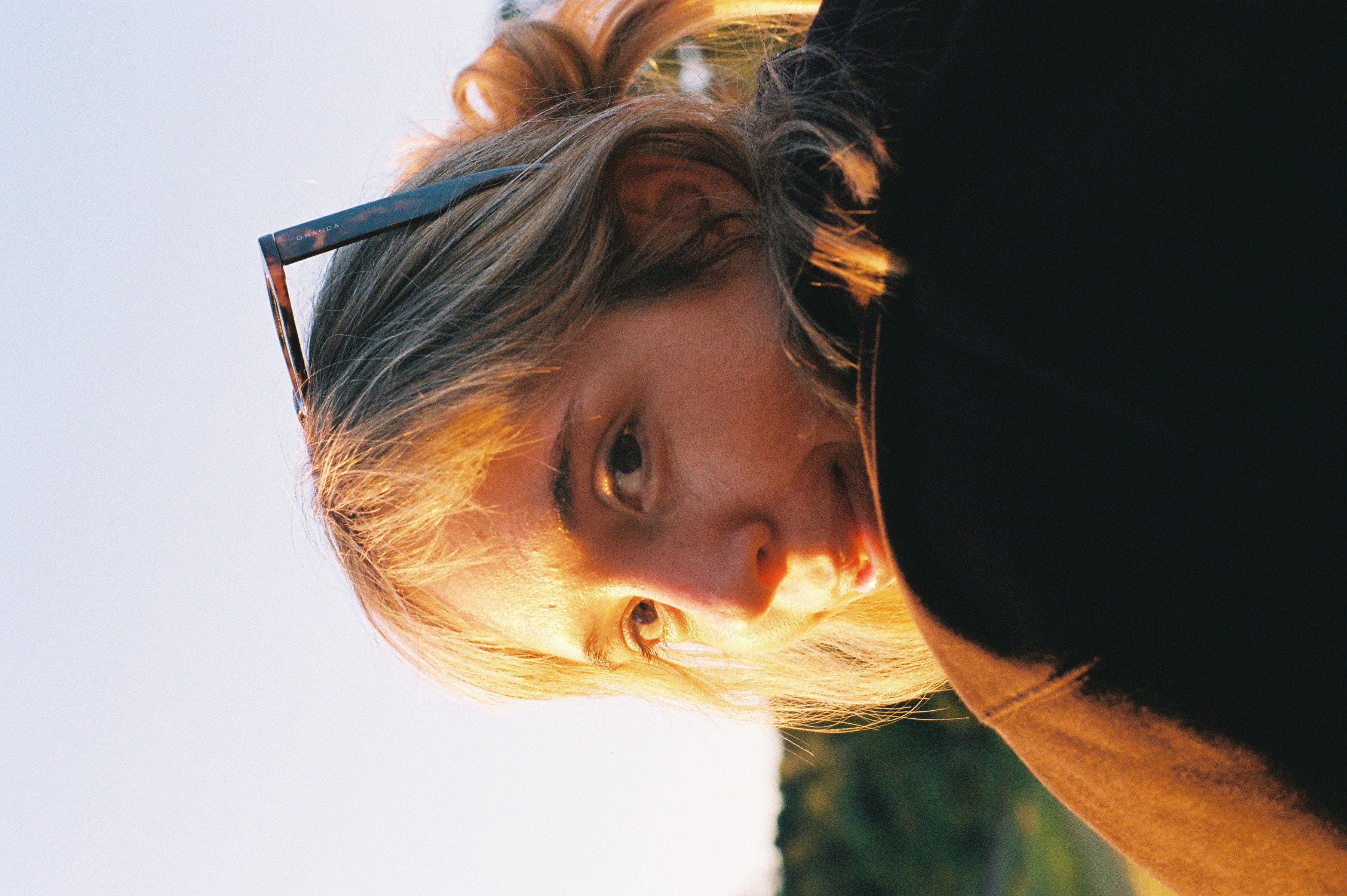Woman relaxing in warm sunlight